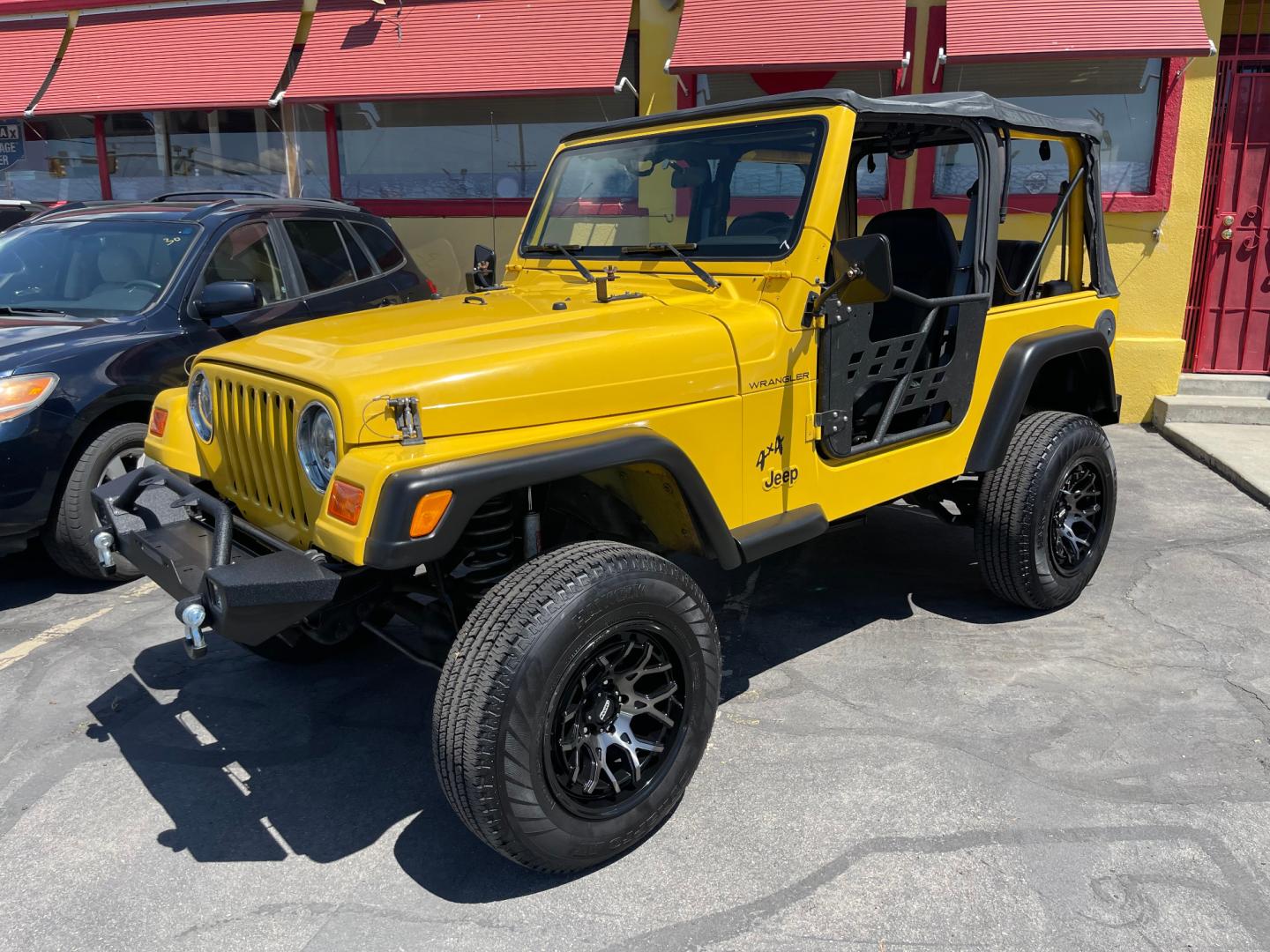 2000 Solar Yellow /Black Jeep Wrangler SE (1J4FA29P9YP) with an 2.5L 4 Cyl. engine, Manual transmission, located at 801 South State Street, Salt Lake City, UT, 84111, (801) 328-0098, 40.751953, -111.888206 - Wow extremely rare to find extra clean Jeep in immaculate condition 4x4! Low miles only 98,248 miles! Interior and exterior are both in excellent shape for the year. This is a clean title no reported accidents on the CarFax history report. It has passed emissions already and is ready to go. Featur - Photo#2